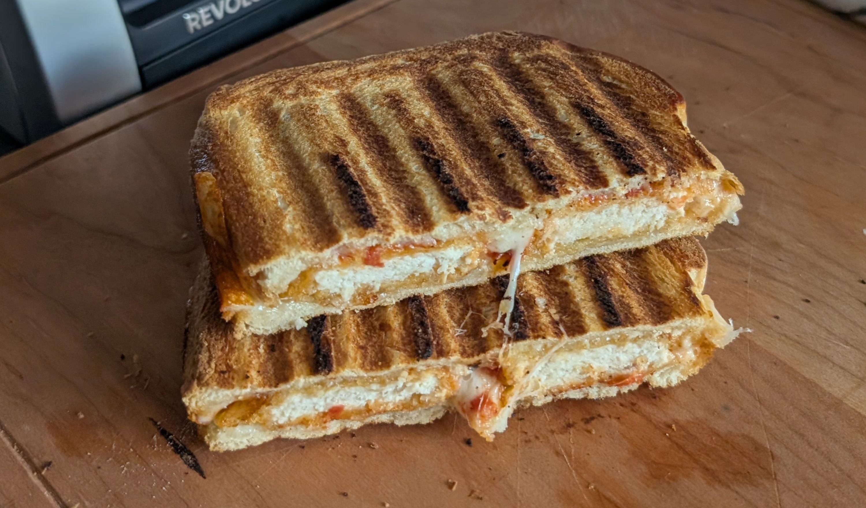 Chicken Nugget Parmesan Sandwich with marinara and provolone toasted golden in the Revolution Toastie Press™