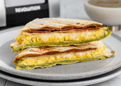 triangle fold breakfast quesadilla on plate