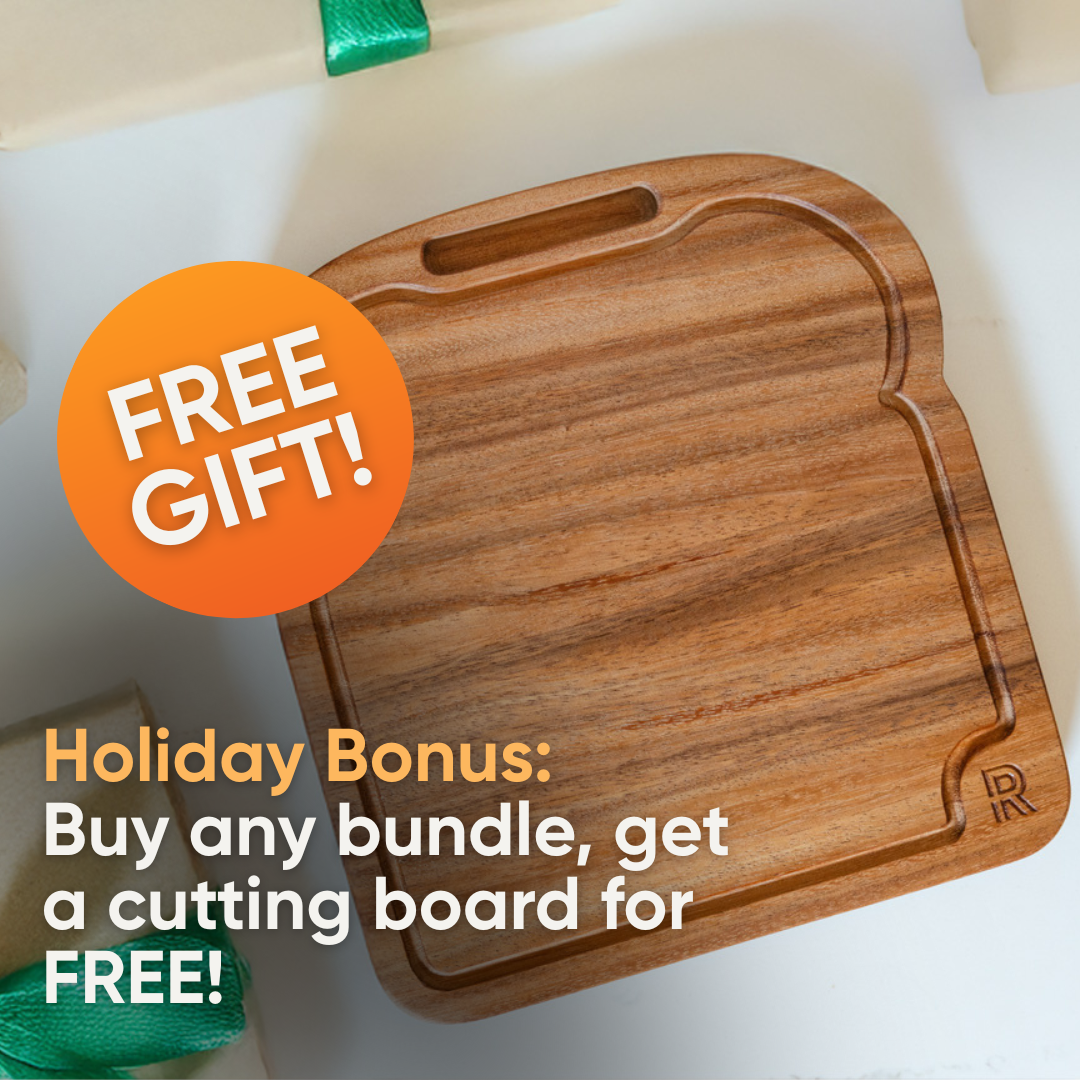 A toast-shaped Hardenbrook Hardwoods Cutting Board sits on a white surface. An orange "FREE GIFT!" badge overlaps it. Below: "Holiday Bonus: Buy any bundle, get a hand-made Hardenbrook Hardwoods Cutting Board FREE!.