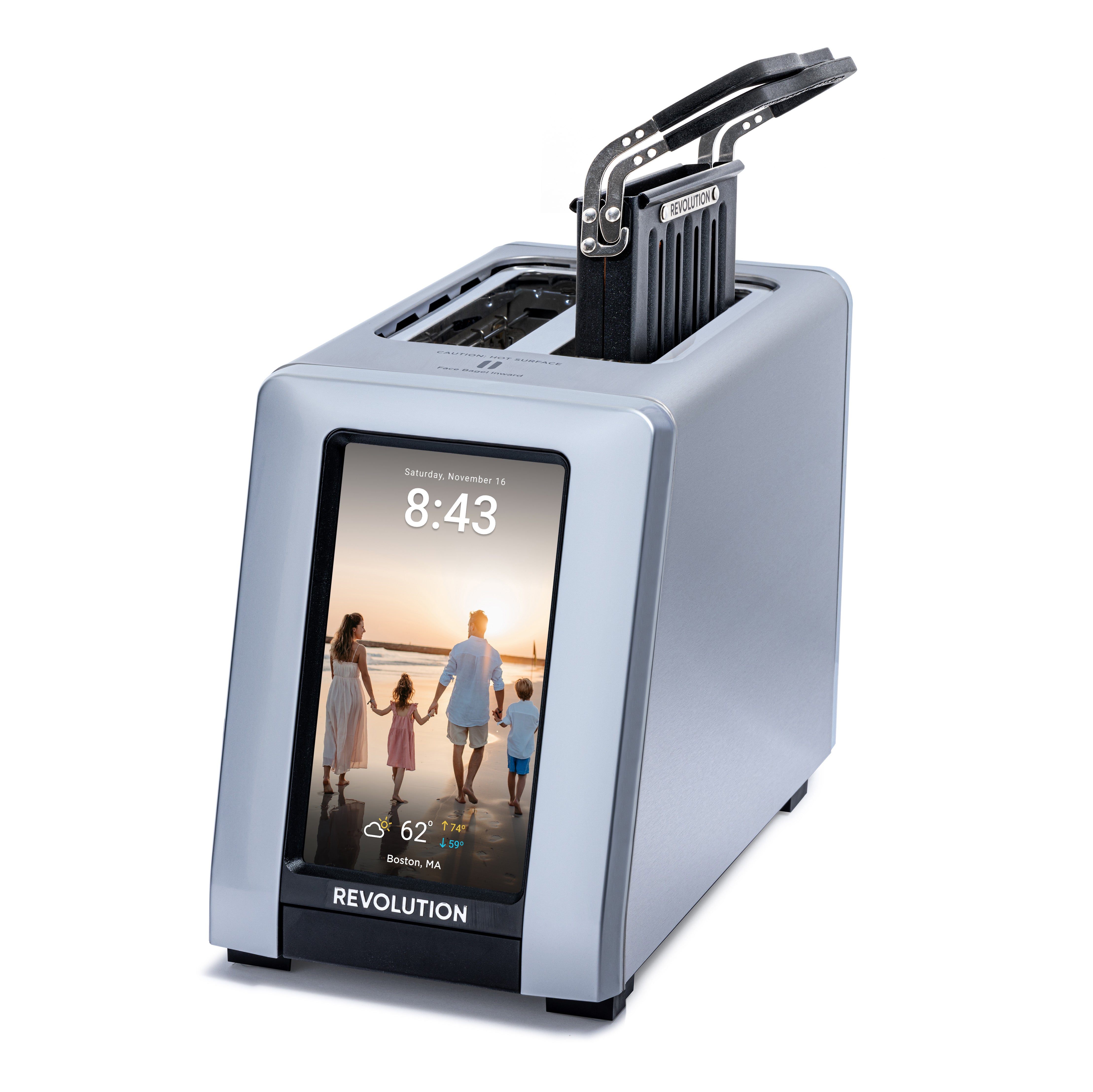 The Revolution Cooking R180 Connect Plus Smart Toaster + Toastie Press features a modern silver design, toasts two slices, and has a large touchscreen display showing time, weather, date, and a family beach photo.