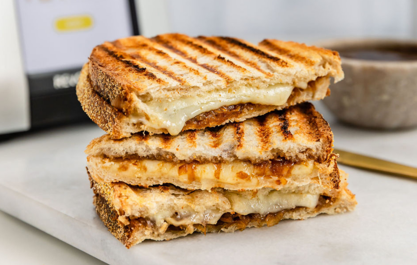 French onion grilled cheese with caramelized onions and melted Swiss on golden toasted bread