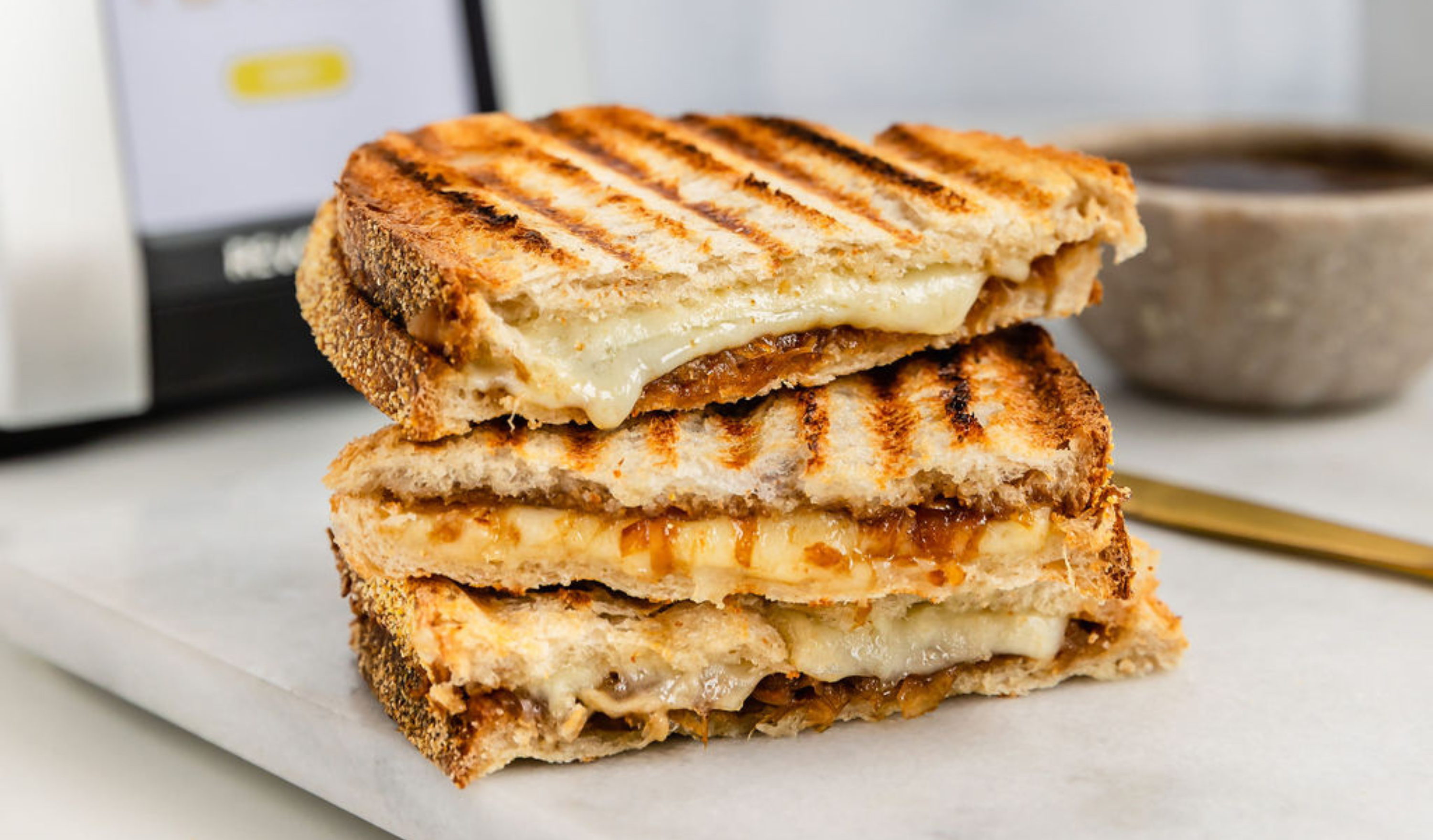 French onion grilled cheese with caramelized onions and melted Swiss on golden toasted bread