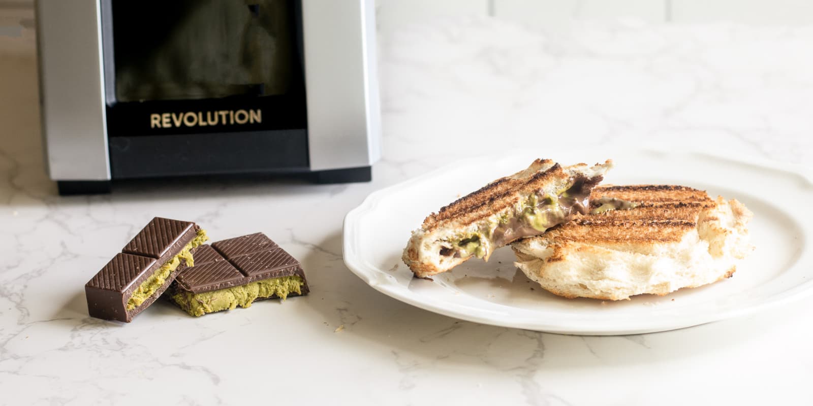 Dubai chocolate toastie with chocolate pistachio center heated in the Revolution toastie press