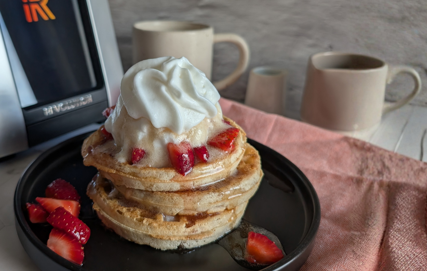 Gluten-free waffles with strawberries and whipped cream toasted in the Revolution Smart Toaster with gluten-free toast settings
