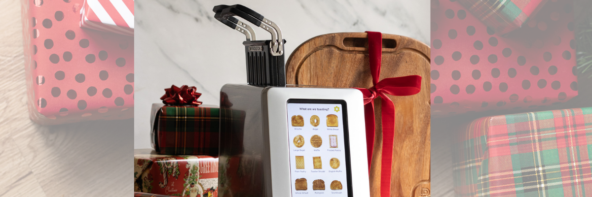 Revolution Cooking smart toaster surrounded by gifts and bows.