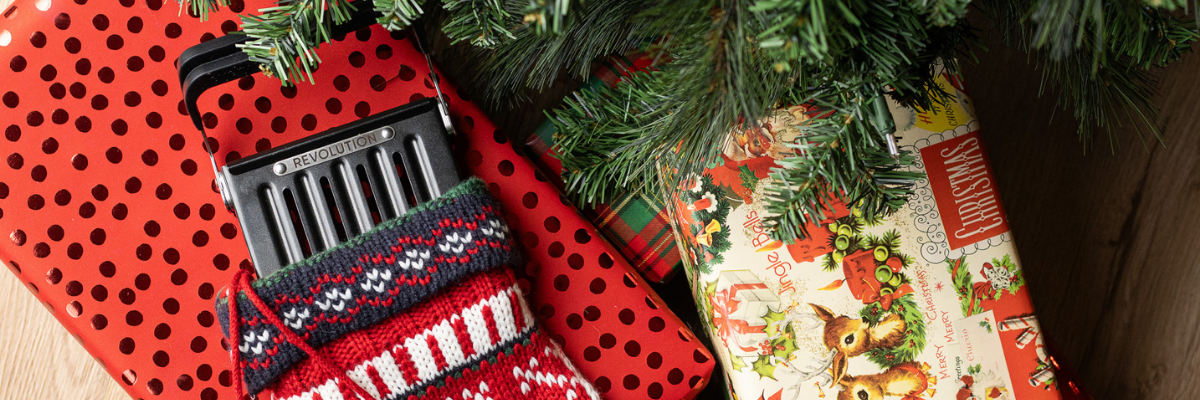 Revolution Toastie Press for making grilled cheese in toaster, wrapped as a gift under a holiday tree