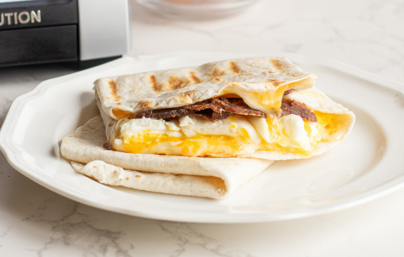 steak and egg breakfast quesadilla pressed in the revolution toastie press