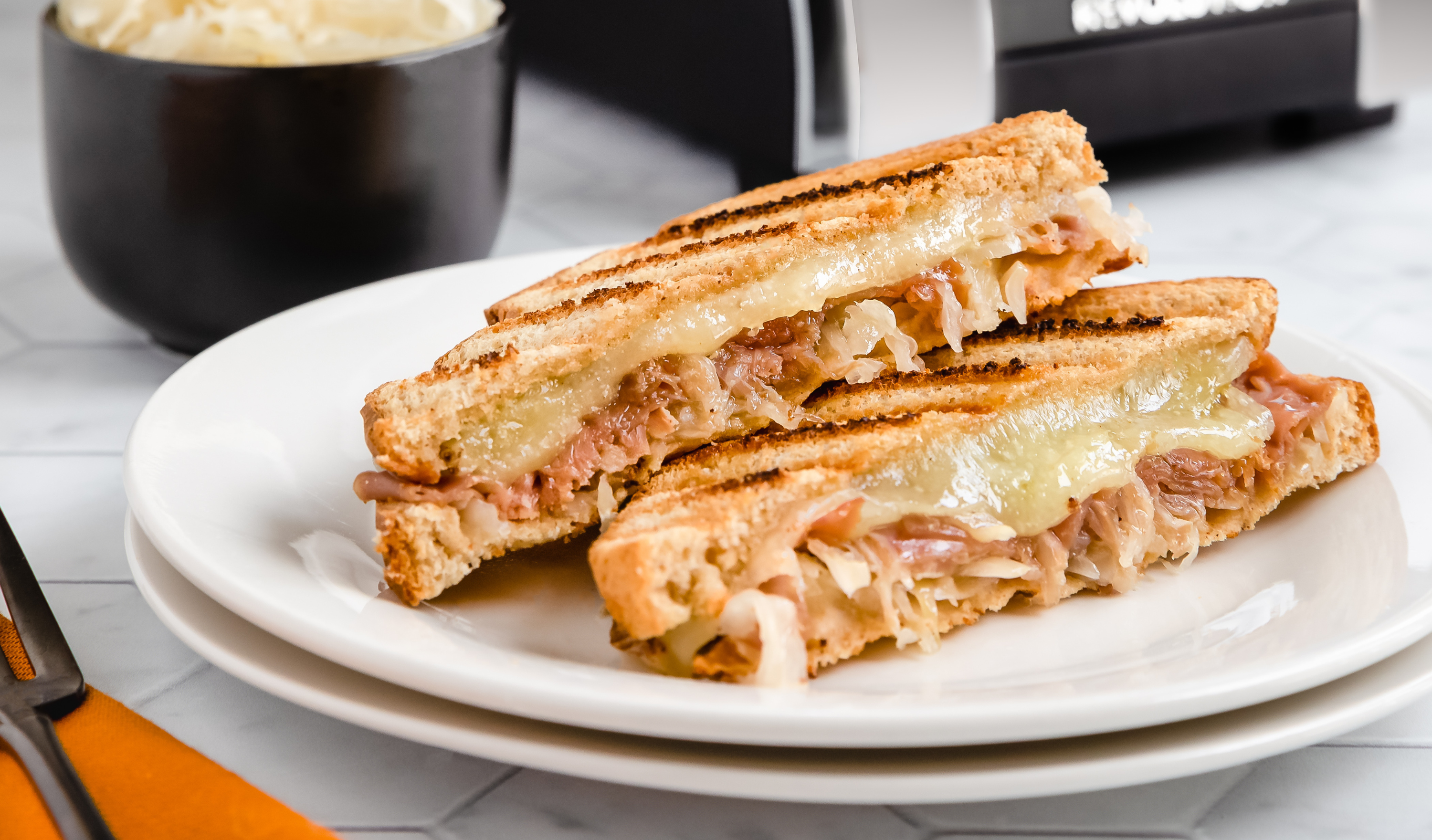 A Taste of Bavaria: German-inspired Grilled Cheese with ham, Swiss, and sauerkraut