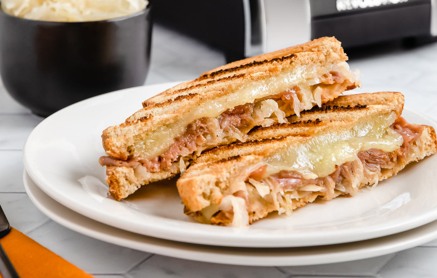 Bavarian grilled cheese sandwich with ham, Swiss cheese, and sauerkraut toasted in the Revolution Toastie Press