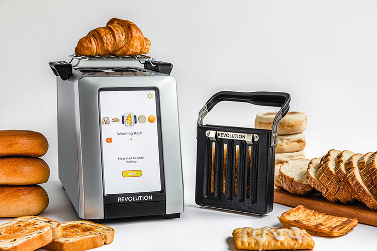 Revolution InstaGLO R270 Toaster with warming rack, panini press, and various bread types. 
