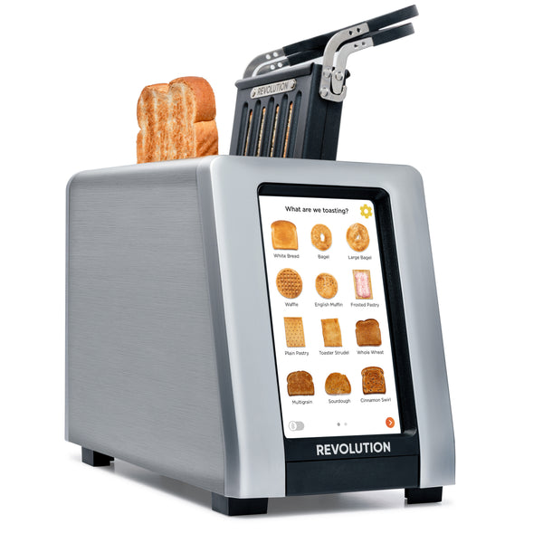 The Revolution Cooking R180 Connect Plus Smart Toaster + Toastie Press features a digital touchscreen with bread options, two slices of toasted bread, a raised metal lever on top, and the brand "Revolution" displayed on the front.